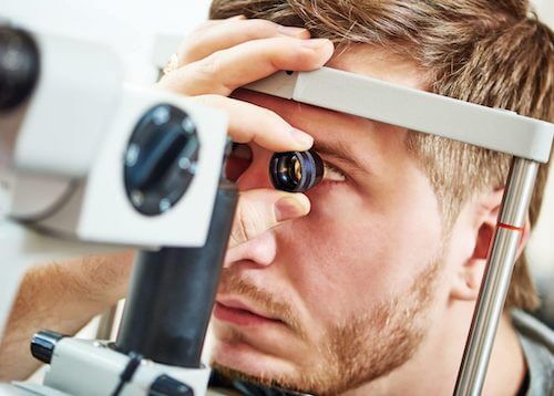 Man having his eyes tested before laser eye surgery Man having his eyes tested before laser eye surgery
