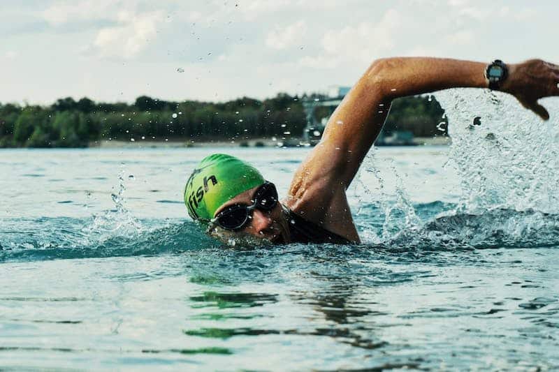 Man swimming in a lake Man swimming in a lake