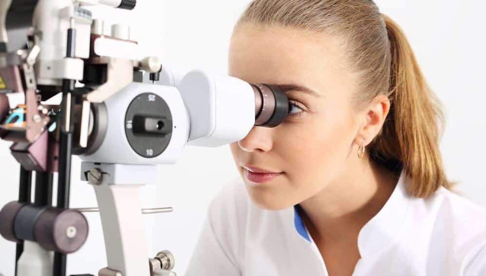 Optometrist examining someone for cataract treatment