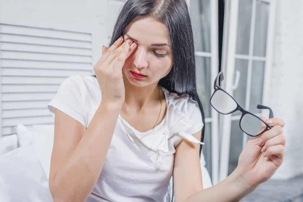 Eyes-Burning Woman rubbing her eyes