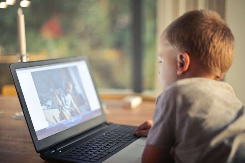 Boy watching something on a computer