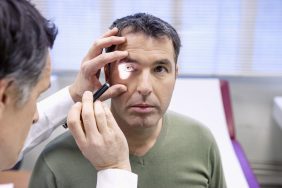 Doctor assessing a patients eyes