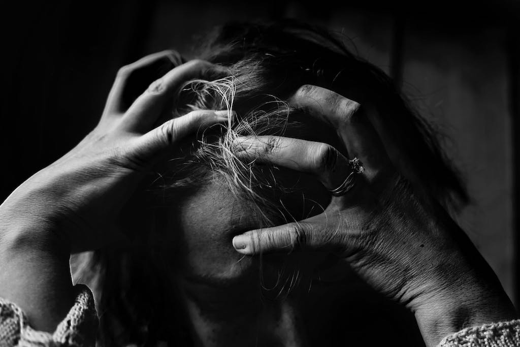 Stressed woman pulling their hair