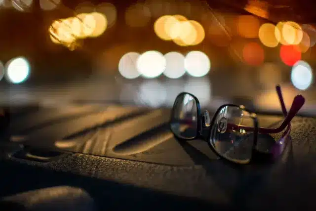 Glasses on a car dashboard