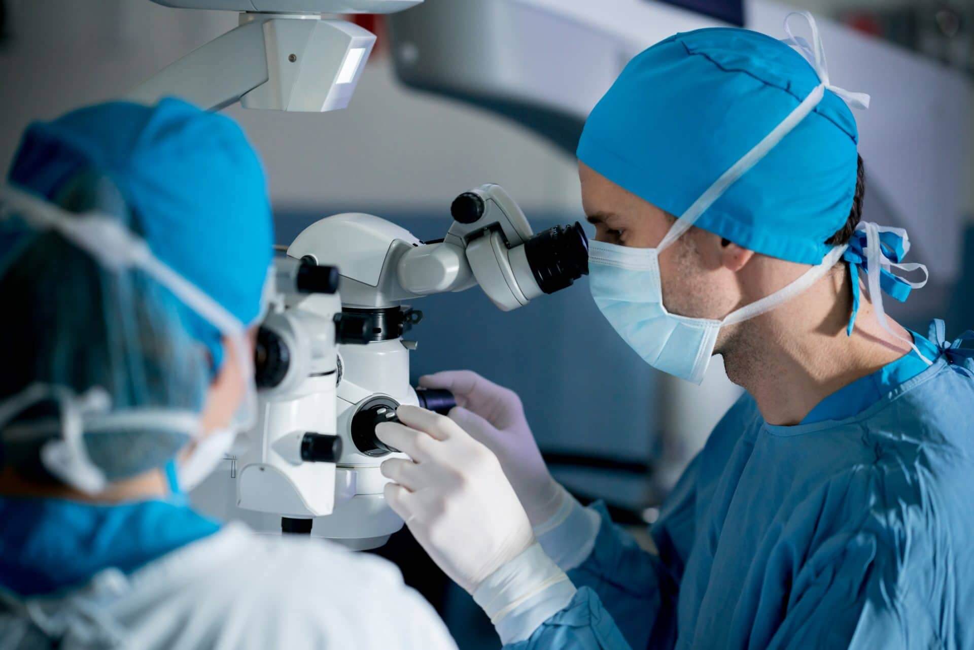 Eye surgeon treating a patient