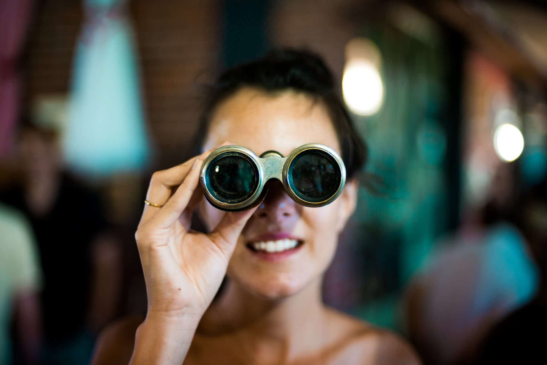 Woman using binoculars